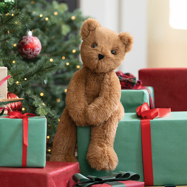 15" Buddy Bear - Front view of Slim seated honey brown bear on a stack of Christmas gifts image number 1