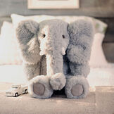 18" Oh So Soft Elephant - Front view of seated gray Elephant in bedroom setting image number 10