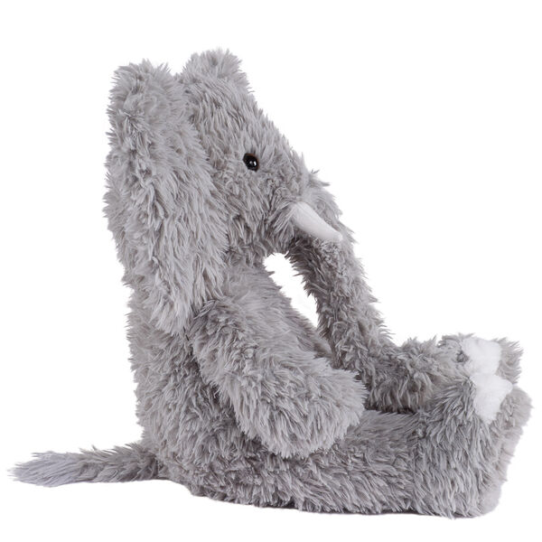 18" Oh So Soft Elephant - Side view of seated gray Elephant with gray foot pads and white tusks and toe nails