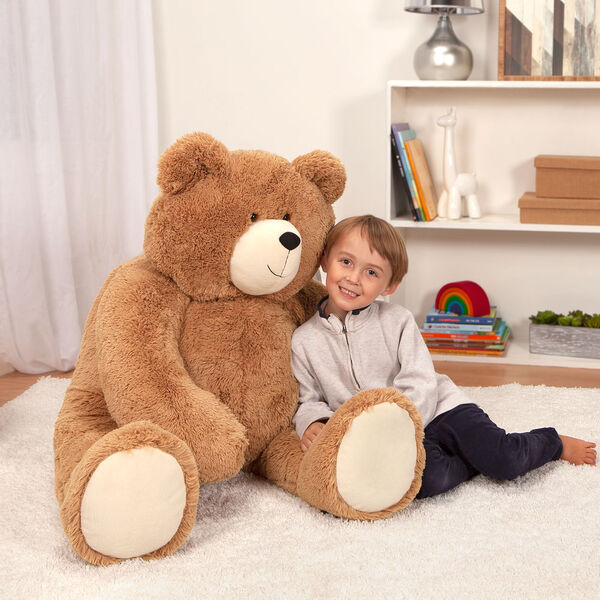 4' Big Hunka Love Bear - Seated golden brown bear with a child model in a bedroom scene image number 8