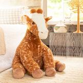3 1/2' Gentle Giant Giraffe - Three quarter view of seated soft giraffe in bedroom scene image number 5
