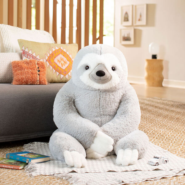 3 1/2' Gentle Giant Sloth - Front view of seated gray and white Sloth in living room setting