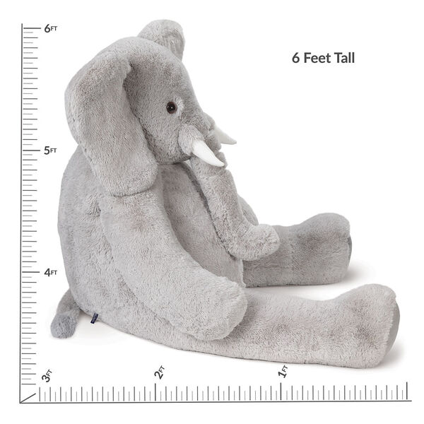 6' Giant Cuddle Elephant - Side view of seated grey plush elephant with measurement of 6 feet tall