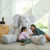 6' Giant Cuddle Elephant - Front view of seated grey plush elephant with girl models in a living room scene image number 11