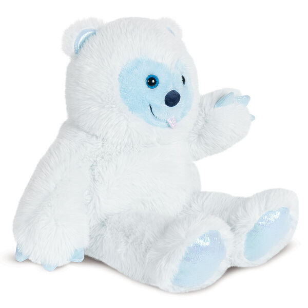18" Fluffy Fantasy Yeti - Side view of white seated stuffed animal Yeti with light blue muzzle and foot pads