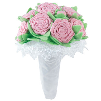 Large pink velvet bouquet with green felt leaves in white satin and lace wrapping on elastics