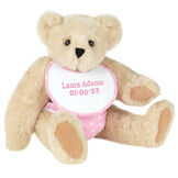 15" Baby Girl Bear - Seated jointed bear dressed in pink with white dots fabric diaper and bib. Bib with "Laura Adams" and "5-1-22" in light pink lettering - Buttercream image number 3
