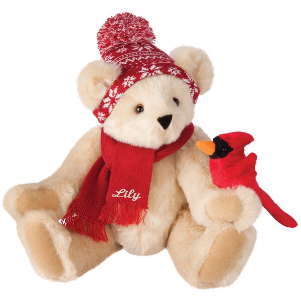 15" Season's Greetings Bear - Front view of seated jointed bear dressed in a knit red and white nordic patterned hat with red scarf and holding a red cardinal. Bottom edge of scarf is personalized with "Lily" in white lettering- Buttercream brown fur image number 2