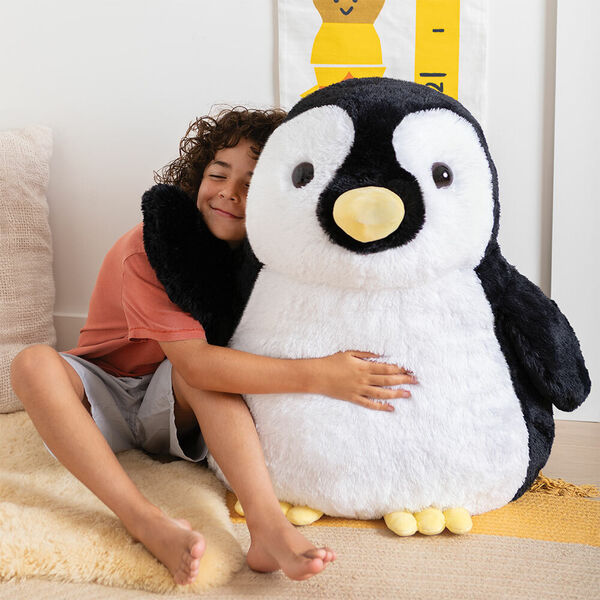 28" Cuddle Penguin - Front view of black and white penguin with yellow beak and feet with a model image number 0